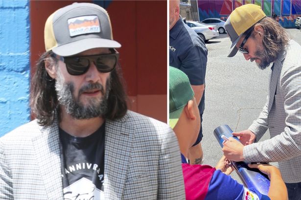 Keanu Reeves shows off grey beard and long hair as he stops to sign autographs for fans