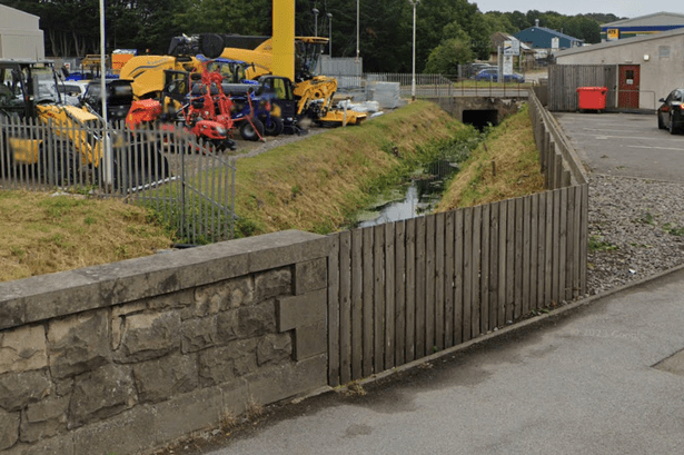 Body discovered in Scots burn as police lock down busy road