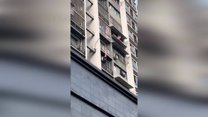 Hero neighbour saves girl hanging from balcony by her neck | News