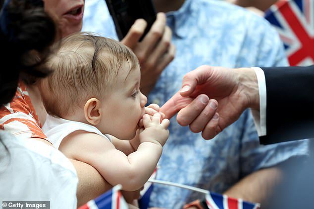 Adorable moment baby bites Prince William’s finger in Singapore: ‘I need my finger back!’