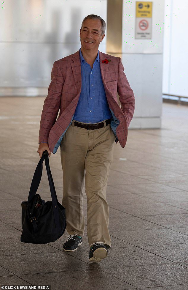 Nigel Farage puffs on a cigarette at Heathrow airport as he heads to Australia –  appearing to CONFIRM his appearance on I’m A Celebrity after ‘row’ over the show’s smoking ban