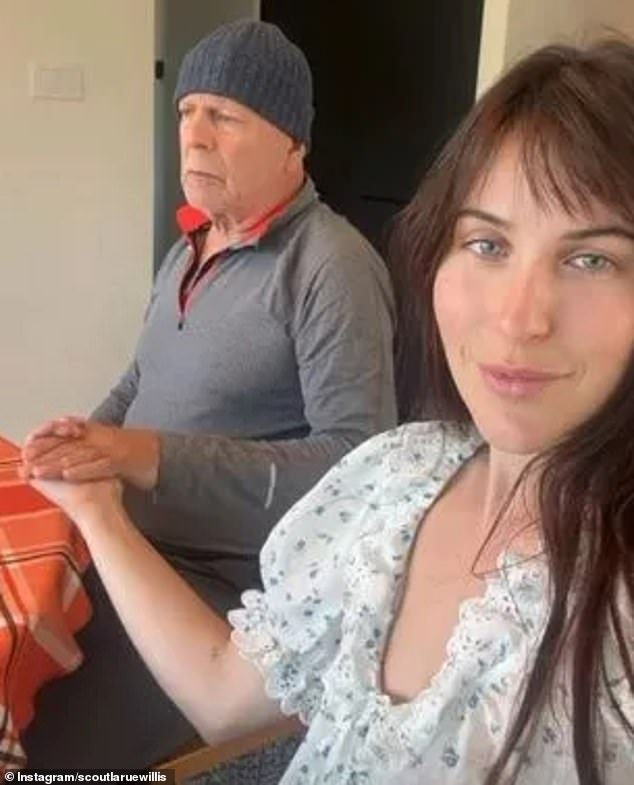 Bruce Willis holds on tightly to his daughter Scout’s hand as he spends Thanksgiving with his family amid his dementia battle