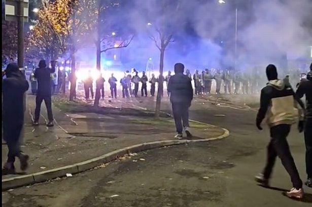 Police charge 26 over Bonfire night 'riot' that left officers injured