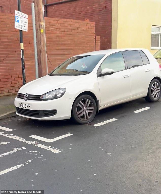 Moment scaffolders wreak their revenge on ‘rude’ motorist refusing to move his car by building a barrier to block him in – but who do you think is in the right?