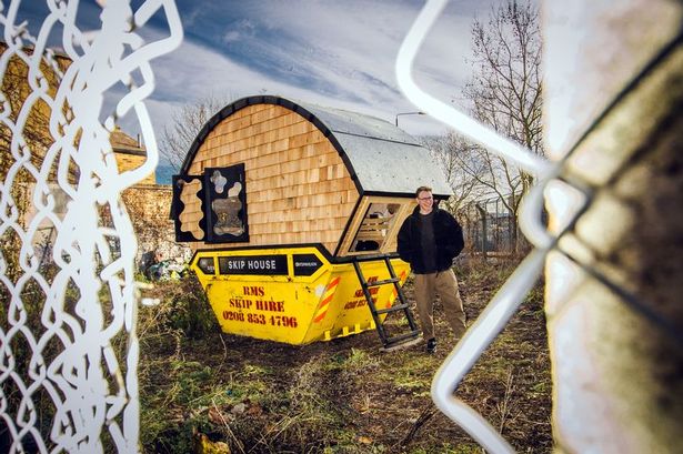 Man moves into skip with bed, fridge and hob to beat cost of living crisis