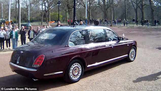 Photographs were taken as the royal car turned out of Clarence House on to the Mall
