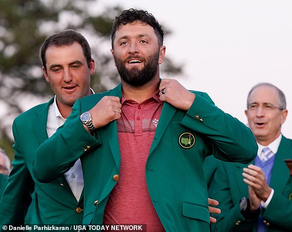 Jon Rahm puts on the traditional Green Jacket after winning the 2023 Masters.