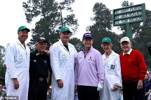 Golf - The Masters - Augusta National Golf Club - Augusta, Georgia, U.S. - April 6, 2023 South Africa's Gary Player, Tom Watson of the U.S. and Jack Nicklaus of the U.S. pose for a photograph with their caddies on the 1st tee during the ceremonial start on the first day of play REUTERS/Brian Snyder