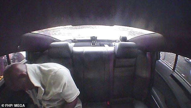The 34-year-old is seen sleeping in his seat in the back of a police car in dash cam footage